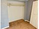 An empty walk-in closet with shelving, ready for customization at 7714 Fox Hollow Dr, Port Richey, FL 34668