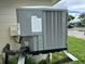 View of a modern HVAC (Heating, Ventilation, and Air Conditioning) unit outside of the home at 7714 Fox Hollow Dr, Port Richey, FL 34668