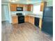 Kitchen with stainless steel appliances and warm wooden cabinets at 7714 Fox Hollow Dr, Port Richey, FL 34668