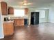 Kitchen featuring black appliances, wooden cabinets and lots of light at 7714 Fox Hollow Dr, Port Richey, FL 34668