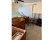 Bedroom featuring unfinished cabinet and exposed walls ready for renovations at 8516 Inwood Dr, Hudson, FL 34667