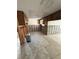 Kitchen area ready to be renovated with tile flooring and exposed plumbing at 8516 Inwood Dr, Hudson, FL 34667