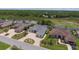 Aerial view of the home showcasing its large yard, pool, and proximity to a lake at 9188 Mississippi Run, Weeki Wachee, FL 34613