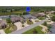 Desirable neighborhood featuring a lake view, well-manicured lawns, and a community pool at 9188 Mississippi Run, Weeki Wachee, FL 34613