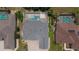 Aerial shot of backyards with screened-in pools at 9188 Mississippi Run, Weeki Wachee, FL 34613