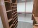 Spacious walk-in closet features custom wood shelving and storage compartments at 9188 Mississippi Run, Weeki Wachee, FL 34613