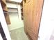 Ample closet space with custom wood shelving and hanging rods for optimal storage at 9188 Mississippi Run, Weeki Wachee, FL 34613