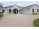 Charming single-story home boasting a spacious driveway and an attached two-car garage at 9188 Mississippi Run, Weeki Wachee, FL 34613