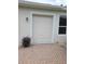 Attached garage with a brick driveway and a well-lit exterior at 9188 Mississippi Run, Weeki Wachee, FL 34613