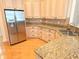 Bright kitchen boasting stainless steel appliances, granite countertops, and ample cabinet space at 9188 Mississippi Run, Weeki Wachee, FL 34613