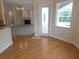 Open-concept living area showcasing hardwood flooring, fireplace, and a view of the pool at 9188 Mississippi Run, Weeki Wachee, FL 34613