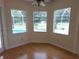 Sun Room with hardwood flooring, large windows providing natural light, and views of the pool at 9188 Mississippi Run, Weeki Wachee, FL 34613