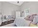 Cozy bedroom with a sloped ceiling, desk area, and bright natural light at 9212 Calle Alta, New Port Richey, FL 34655