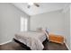 Neutral bedroom featuring a sloped ceiling, shuttered window, and wood floors at 9212 Calle Alta, New Port Richey, FL 34655