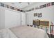 Fun bedroom featuring a shelf filled with albums, a guitar, and instruments at 9212 Calle Alta, New Port Richey, FL 34655