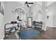 Bright exercise room boasts vaulted ceilings, an arched window, and assorted fitness equipment at 9212 Calle Alta, New Port Richey, FL 34655