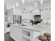 Stylish kitchen with marble countertops, stainless steel appliances, and a spacious island at 9212 Calle Alta, New Port Richey, FL 34655