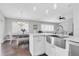 Well-lit kitchen with stainless appliances and a combined dining area at 9212 Calle Alta, New Port Richey, FL 34655