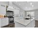 Elegant kitchen featuring stainless appliances, a center island, and outdoor view at 9212 Calle Alta, New Port Richey, FL 34655