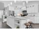 Bright kitchen with marble countertops, stainless steel appliances, and a stylish range hood at 9212 Calle Alta, New Port Richey, FL 34655