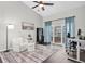 Inviting living room with ample natural light, ceiling fan, and sliding glass doors at 9212 Calle Alta, New Port Richey, FL 34655