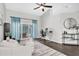 Bright living room featuring hardwood floors, modern furniture, and backyard access at 9212 Calle Alta, New Port Richey, FL 34655