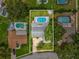 Aerial view of home with well-maintained backyard, screened-in pool, and lush lawn at 2827 Oak Tree Ln, Palm Harbor, FL 34684