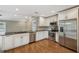 Well-equipped kitchen with stainless steel appliances and granite counters is ready for cooking at 2827 Oak Tree Ln, Palm Harbor, FL 34684