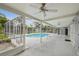 Enjoy outdoor living with this screened-in pool and spacious covered patio at 2827 Oak Tree Ln, Palm Harbor, FL 34684