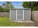 The backyard has a shed, and a fenced yard at 2827 Oak Tree Ln, Palm Harbor, FL 34684