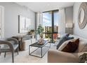 Modern living room with large window and stylish furniture at 1558 4Th St # 406, Sarasota, FL 34236