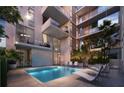 Modern apartment building with a refreshing pool area at 430 Kumquat Ct # 504, Sarasota, FL 34236