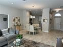 Bright dining room with glass table and view of kitchen at 593 Azure Rd, Venice, FL 34293