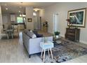 Spacious living room features an open floor plan with kitchen views at 593 Azure Rd, Venice, FL 34293