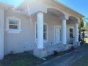 Exterior view of a two-story house with a covered entryway and columns at 2781 Shady Ave, North Port, FL 34286