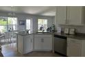 Modern kitchen with granite countertops and stainless steel appliances at 1139 Euclid Rd, Venice, FL 34293