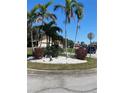 Attractive landscaping with palms and stone features adds curb appeal to this property at 4989 Clubview E Ct, Bradenton, FL 34203