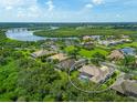 Luxury property with pool and lush surroundings, overlooking a waterway at 11826 River Shores Trl, Parrish, FL 34219