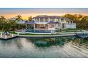 Stunning waterfront property featuring a large pool and private dock at 535 70Th St, Holmes Beach, FL 34217