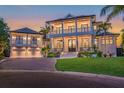Two-story home with a covered porch and attached garage at 535 70Th St, Holmes Beach, FL 34217
