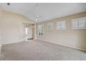 Bright living room features large windows with plantation shutters and neutral color palette at 4063 Caddie E Dr, Bradenton, FL 34203