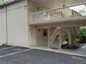 Condo building entrance with stairs and balcony at 3360 S Osprey Ave # 102B, Sarasota, FL 34239