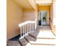 Brick entryway steps leading to the front door of a home at 5273 Heron Way # 202, Sarasota, FL 34231