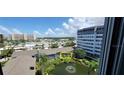Condo unit near pond with surrounding buildings visible at 1046 W Peppertree Ln # 115B, Sarasota, FL 34242