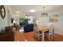 Bright dining area with hardwood floors and a casual dining setting at 1801 Gulf N Dr # 248, Bradenton Beach, FL 34217