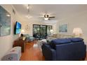 Comfortable living room with hardwood floors, a sofa, and a TV at 1801 Gulf N Dr # 248, Bradenton Beach, FL 34217