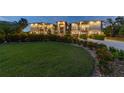 Luxury waterfront home with lush landscaping at 6680 Gulf Of Mexico Dr, Longboat Key, FL 34228