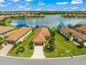 Single Gathering home with a lake view in a quiet community at 243 Cassano Dr, Nokomis, FL 34275