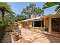 Inviting front patio with flagstone flooring and lush landscaping at 1713 North Dr, Sarasota, FL 34239