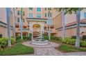 Inviting courtyard entrance with fountain at 401 N Point Rd # 901, Osprey, FL 34229
